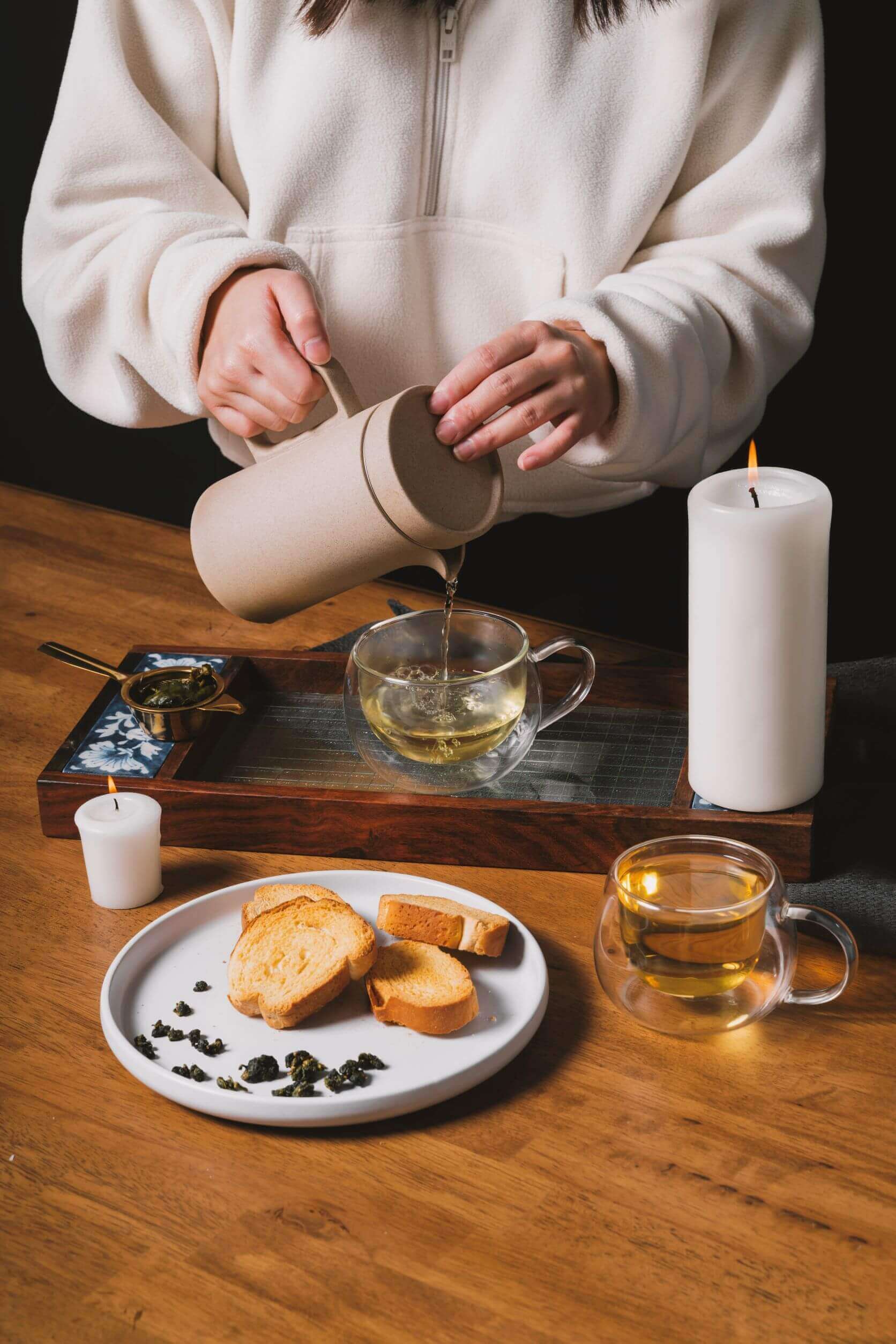 pouring oolong tea into cup