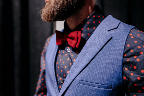 Man Wearing Red Bow Tie with Vest