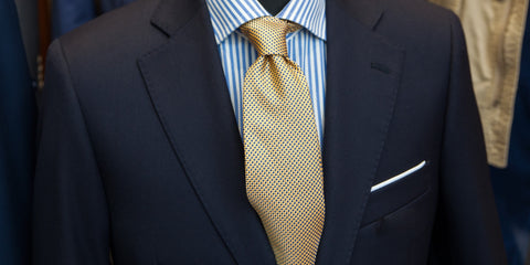 Gold Tie on Black Suit with White Square