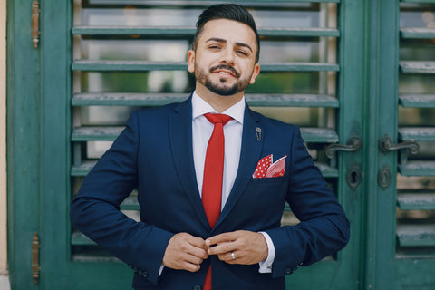 Man Wearing Red Tie, Blue Suit and Pocket Square