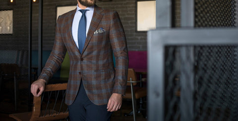 Man Wearing Brown Plaid Suit with Blue Necktie