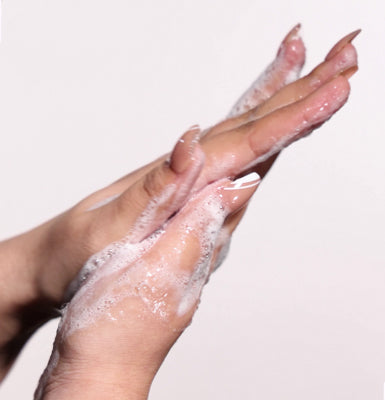 <p>Rub your hands to make bubbles, and gently massage your face.</p>