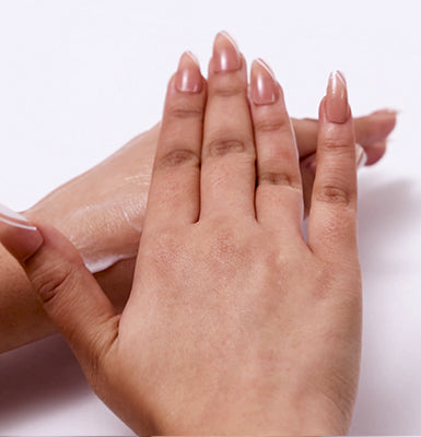 <p>Use your fingertips to massage it into your skin gently using circular motions.</p>