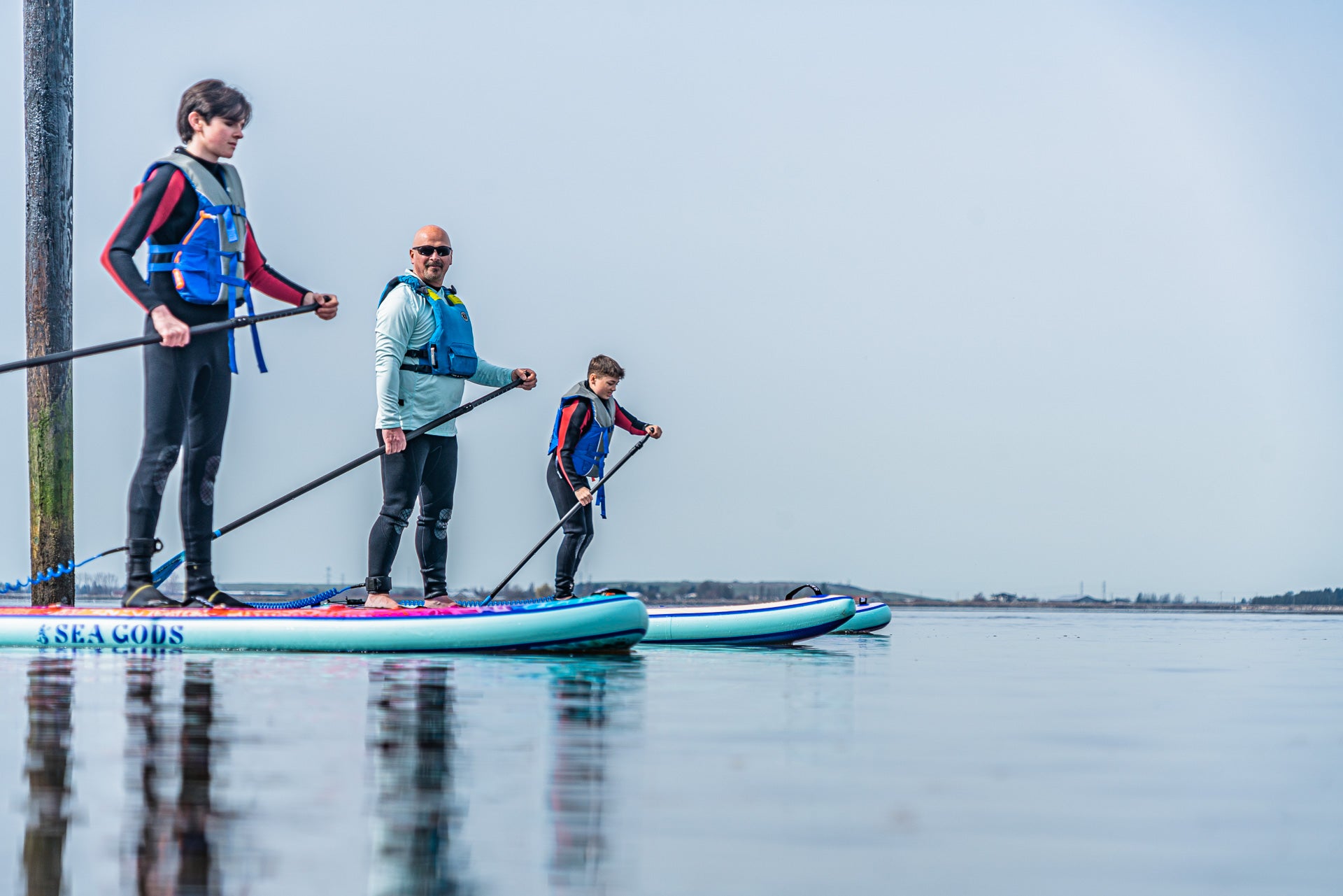 stand up paddle boarding for seniors - social outing with grandkids