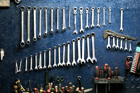 Garage tools displayed on a wall. 