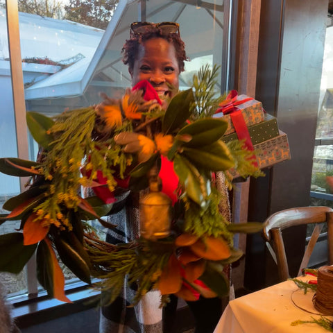 happy black woman corporate wreath workshop atlanta at rays on the river
