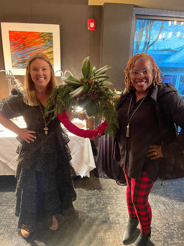 corporate wreath workshop atlanta at rays on the river white florist with black apron