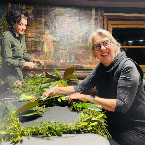 women at a table at a wreath workshop in alpharetta georgia