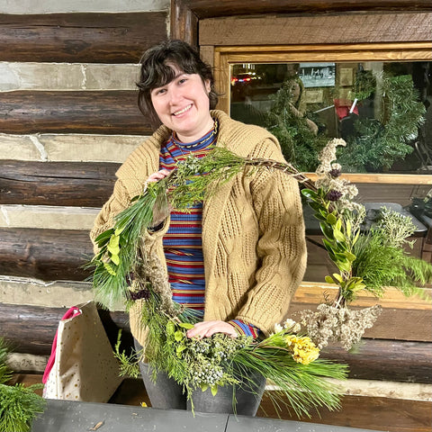 brunette girl holding a wreath