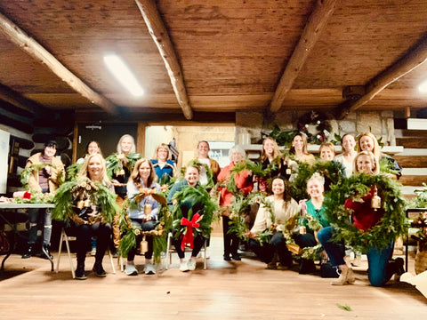 group-photo-of-women-in-a-log-cabin-at-wreath-workshop-in-alpharetta-georgia