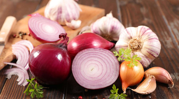 Onions and garlic contain compounds that can damage a dog's red blood cells and cause anemia.