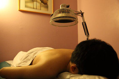 acupuncture with a heat lamp