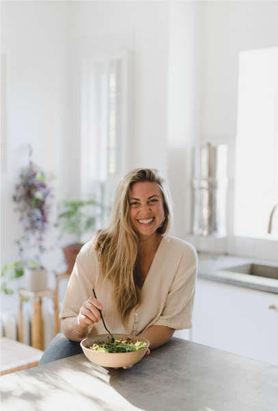 Sarah Britton leaning on the counter in the kitchen