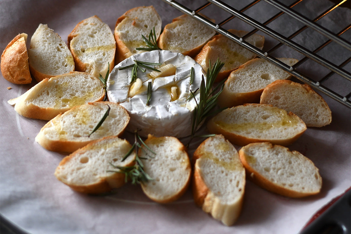 Baked brie and crostini coming out of the oven