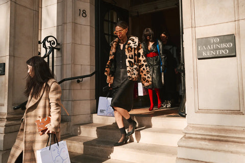 woman with black pencil skirt, black top and leopard jacket