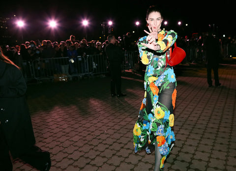 woman with a flower printed dress with sheer details