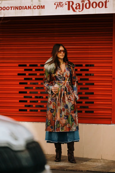 woman with printed coat and denim skirt