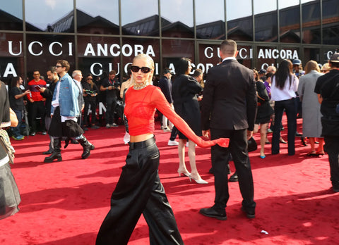 woman with red top and black slacks