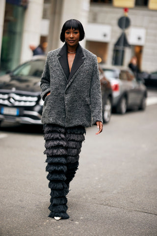 woman with grey oversized jacket and textured grey pants