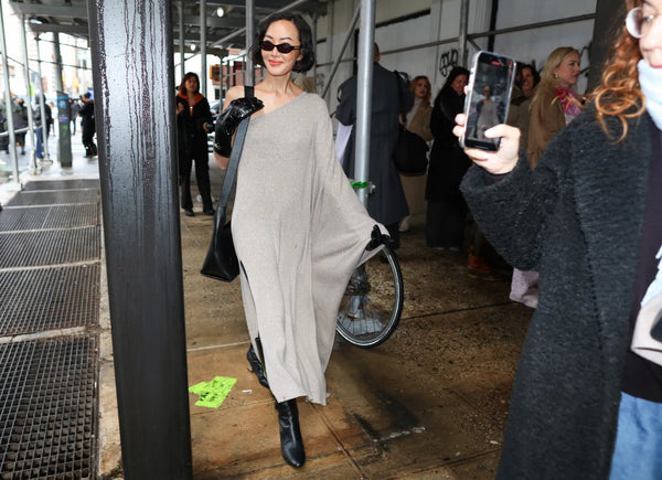 woman with asymmetrical grey maxi dress