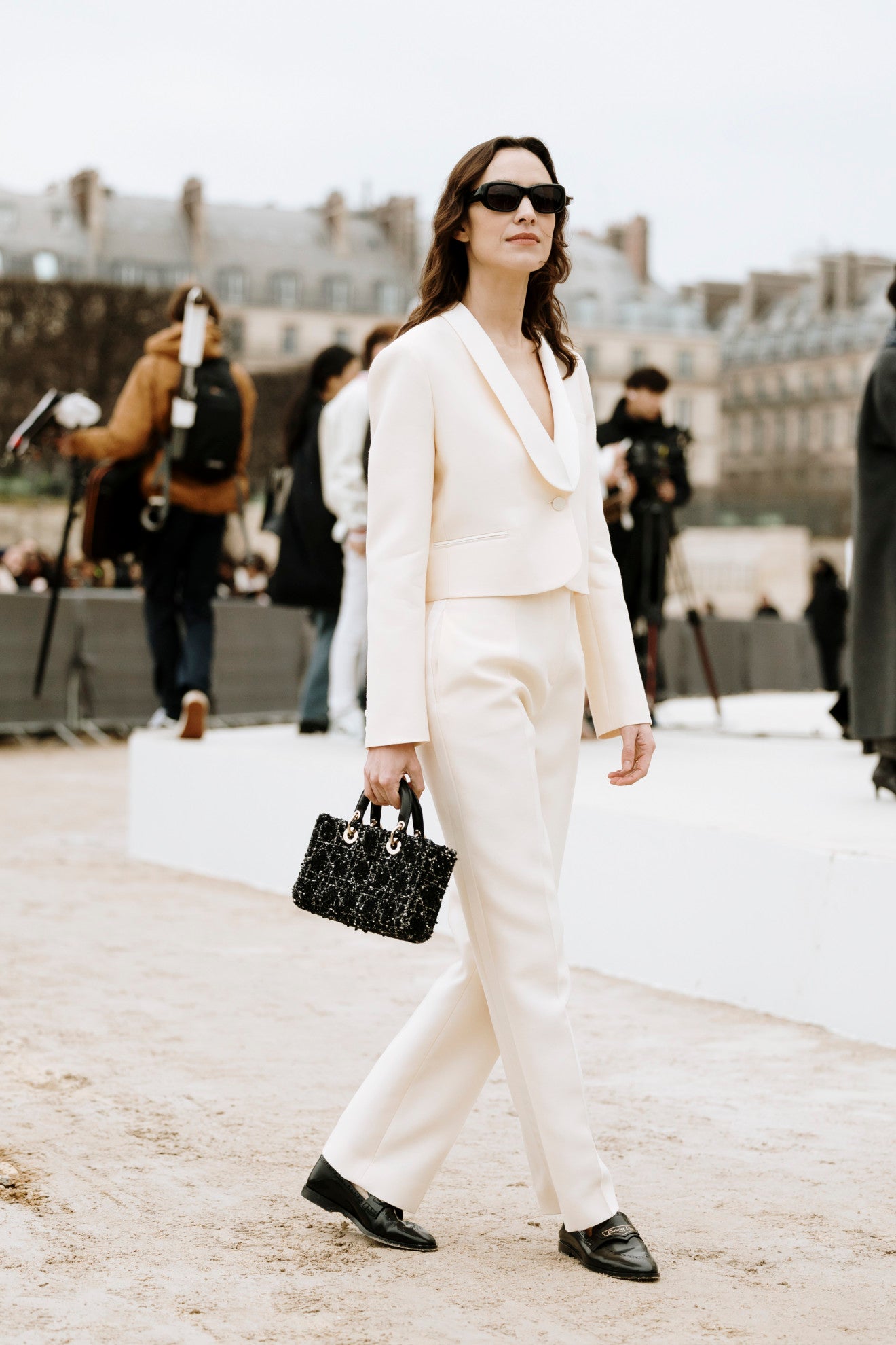 image of Alexa Chung wearing an ivory crop jacket and pants