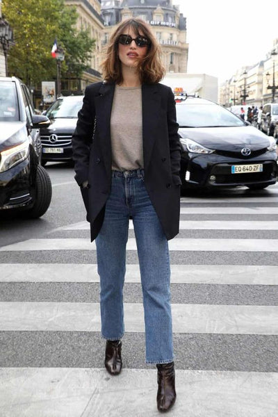 woman with knitted sweater, blazer, jeans and ankle boots