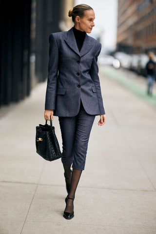 woman with grey blazer and capri pants