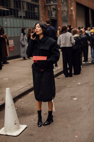 woman with black outfit and black socks