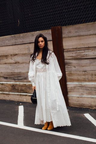 woman with total white outfit with lace details