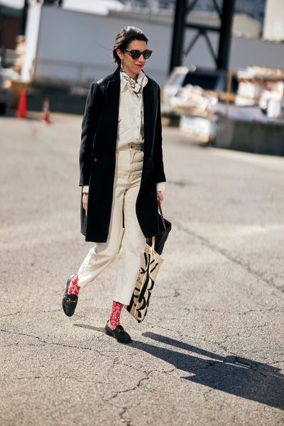 woman with jeans and colourful socks