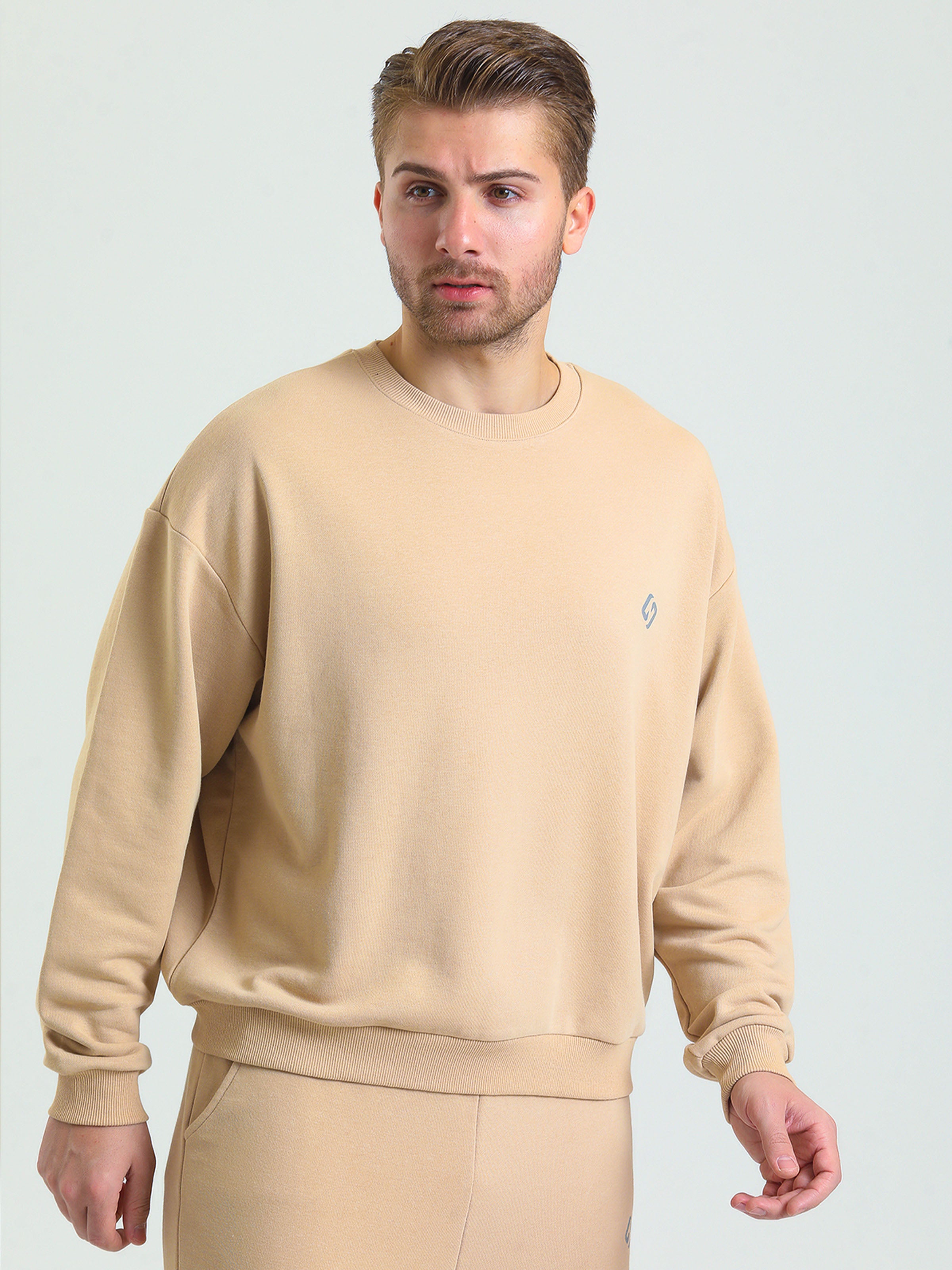 A Man Wearing Light Beige Color Oversized Gender-Neutral_Crew-Neck Cotton Sweatshirt