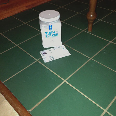 a green floor that had been cleaned with Stain Solver with greatly improved grout color.