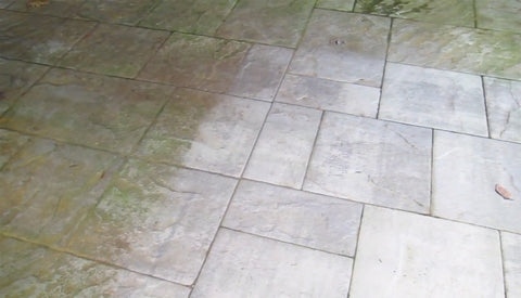  a photo of a patio with a section that is cleaned and section that has not been cleaned