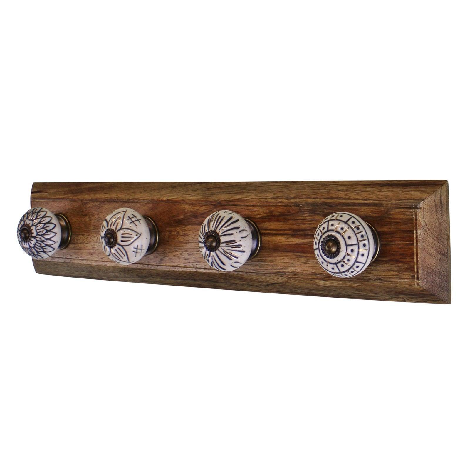 View 4 Single Ceramic Ivory Coat Hooks On Wooden Base information