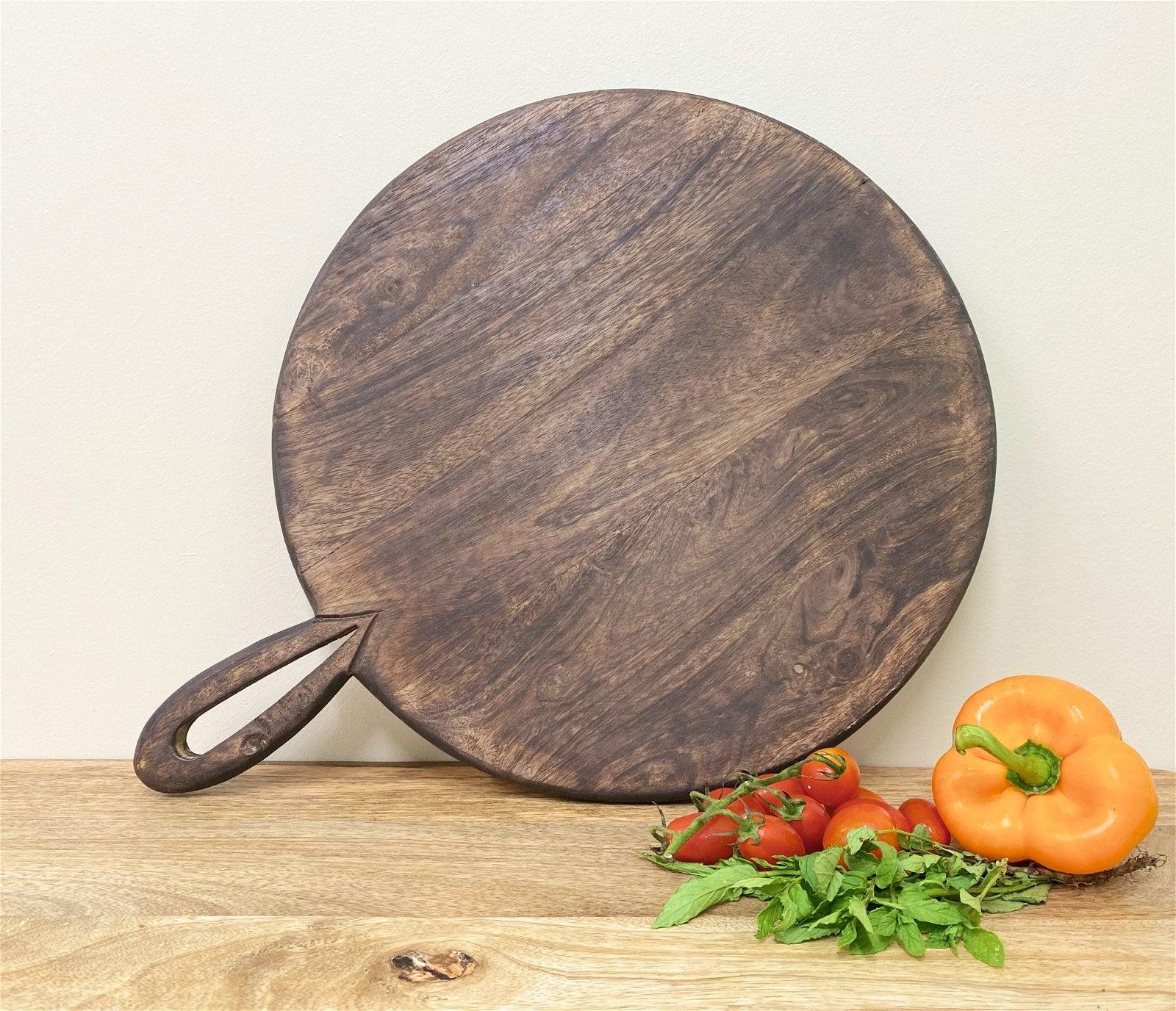 View Circular Wooden Chopping Board With Carved Handle 49cm information