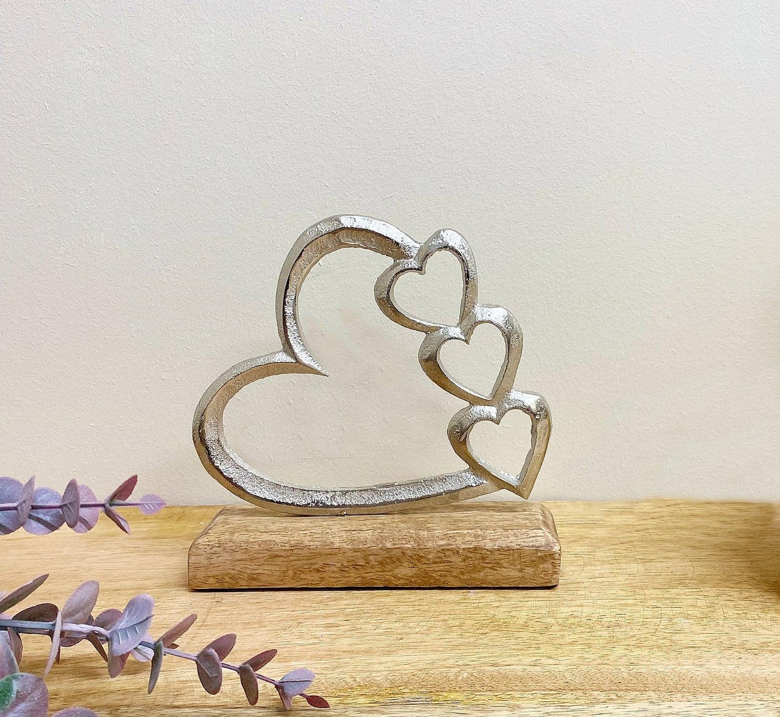 View Metal Silver Four Heart Ornament On A Wooden Base Small information