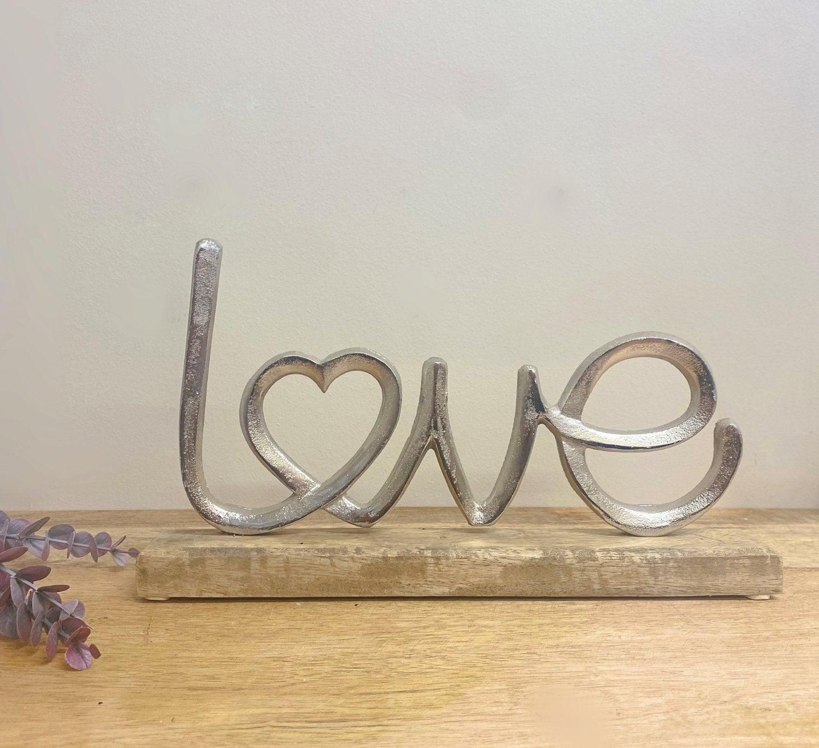 View Metal Silver Love Ornament On A Wooden Base information