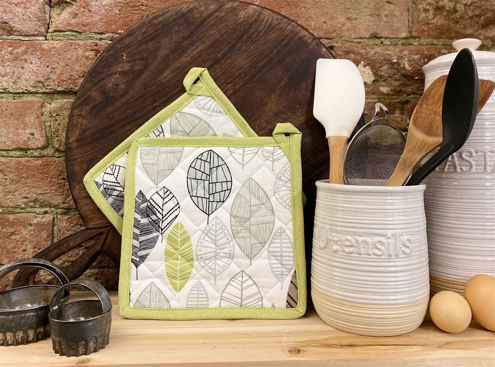 View Two Fabric Pot or Pan Mats With Contemporary Green Leaf Print Design information