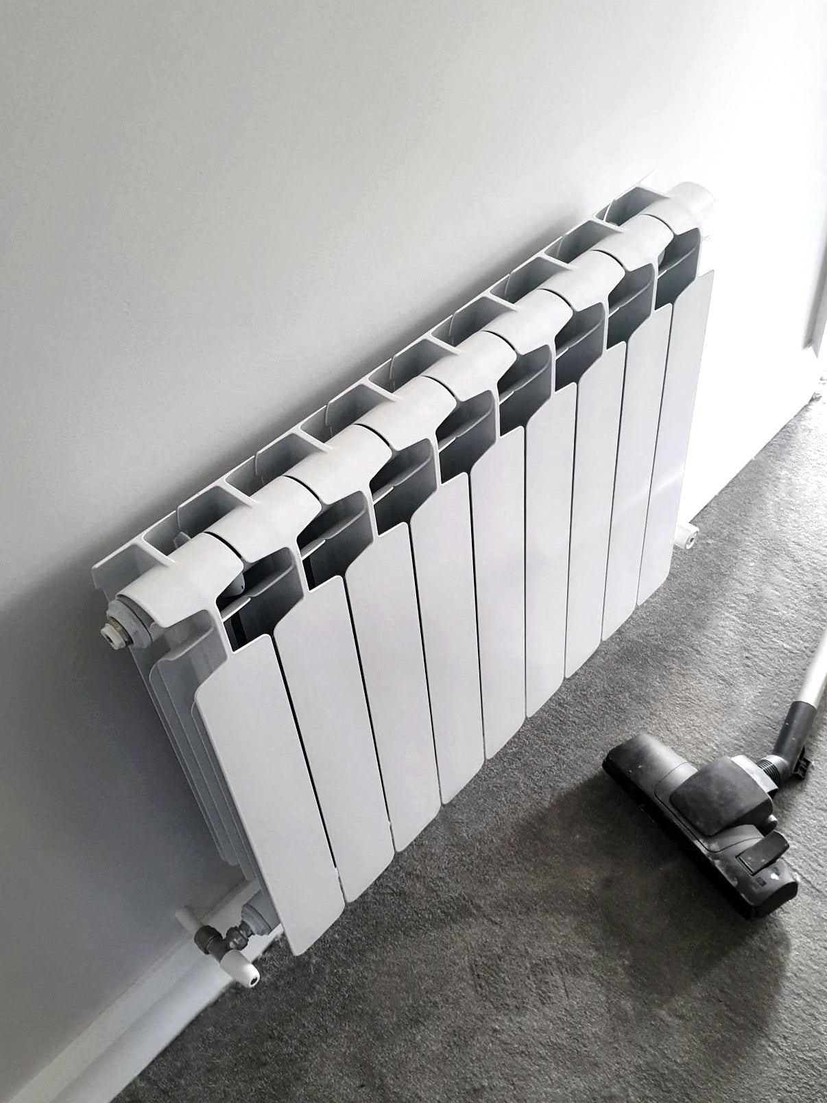 white aluminium radiator in hall