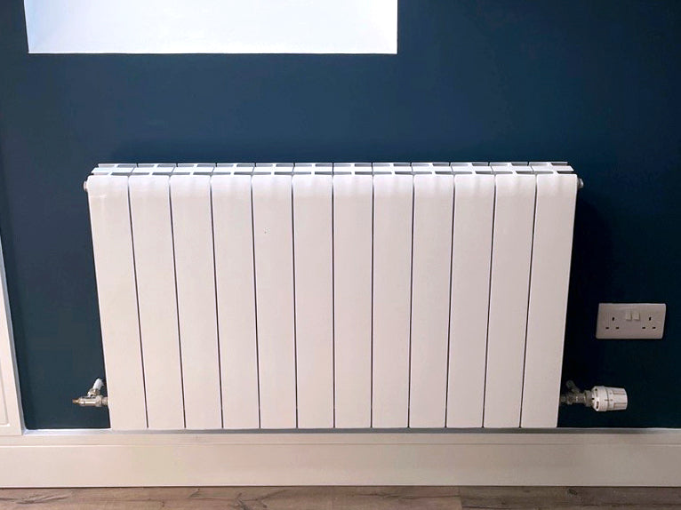 Ali Royal model aluminium radiator in bedroom