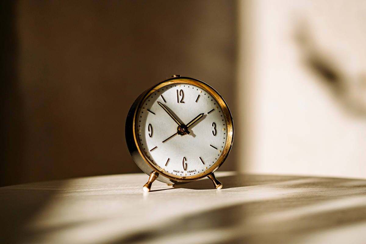 An alarm clock representing the time to wait when intermittent fasting.