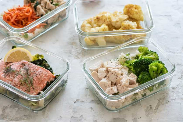 close up of prepped food in glass containers