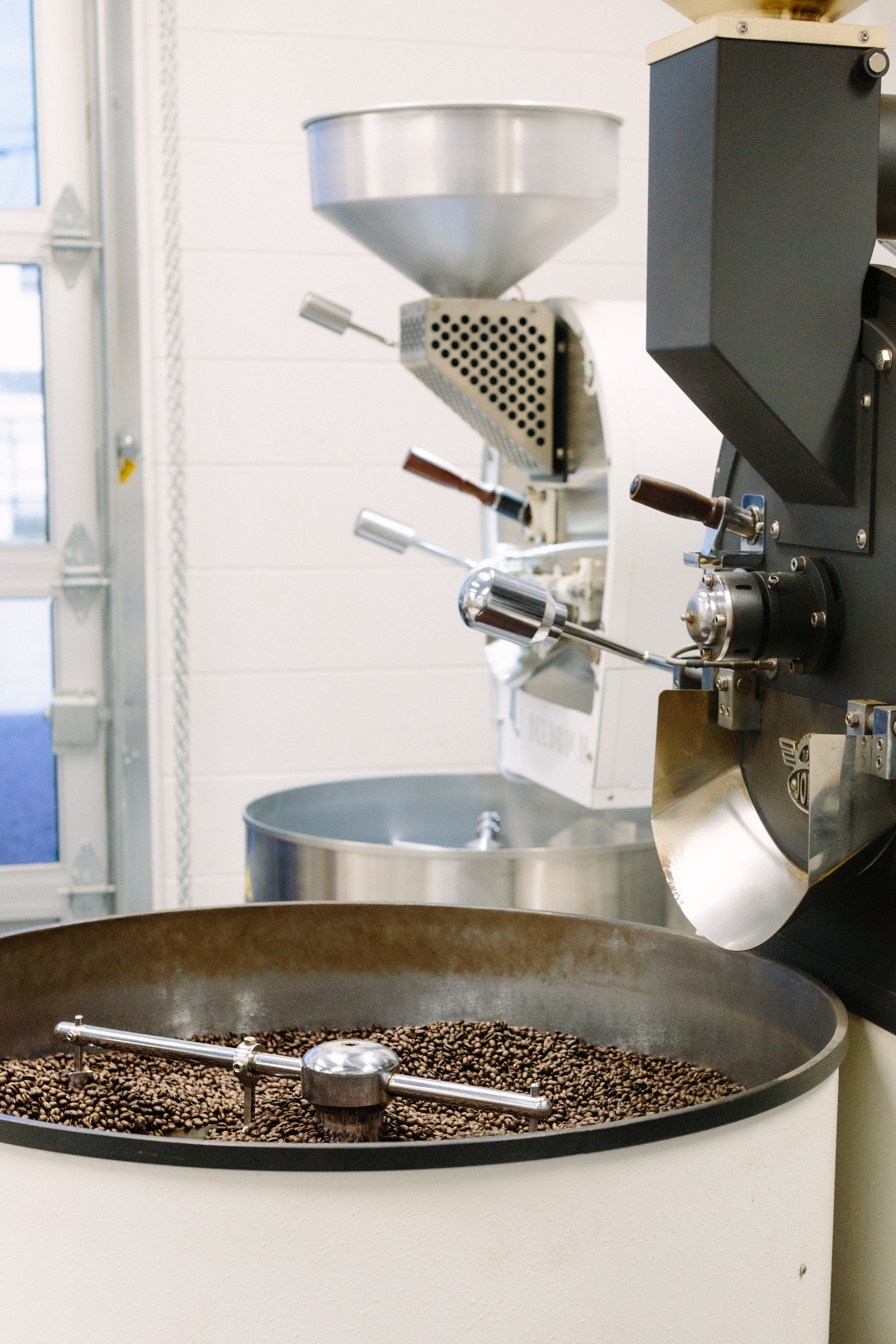 Undershot of an espresso pour with crema visible from the portafilter