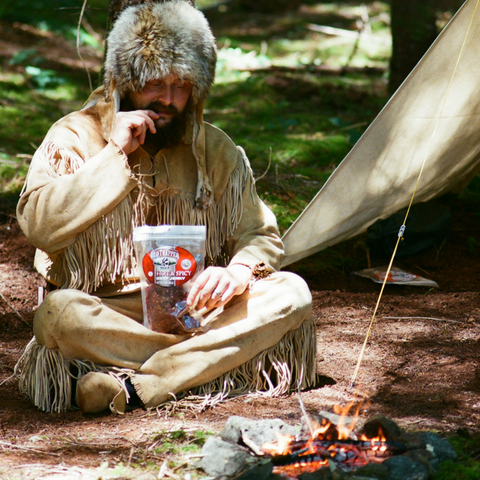 Old Trapper at the Campfire