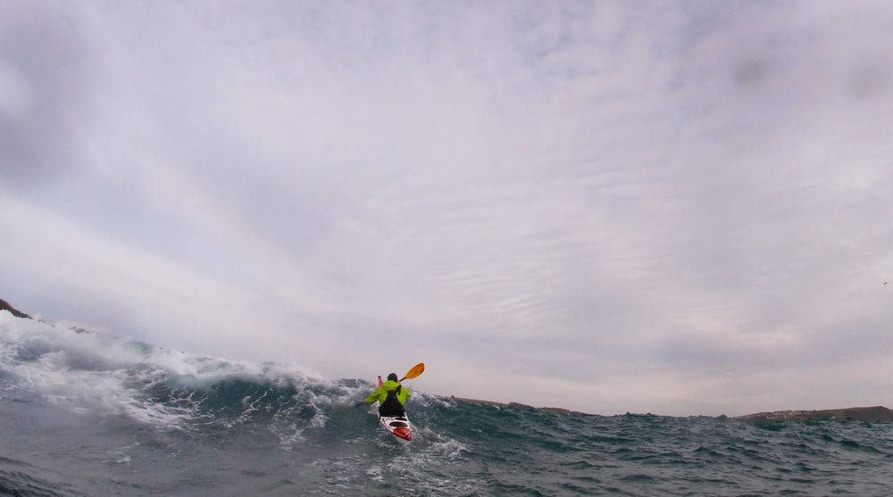 Andrew pushing the Norse Bylgja over powerful breaking swell in Cornwall