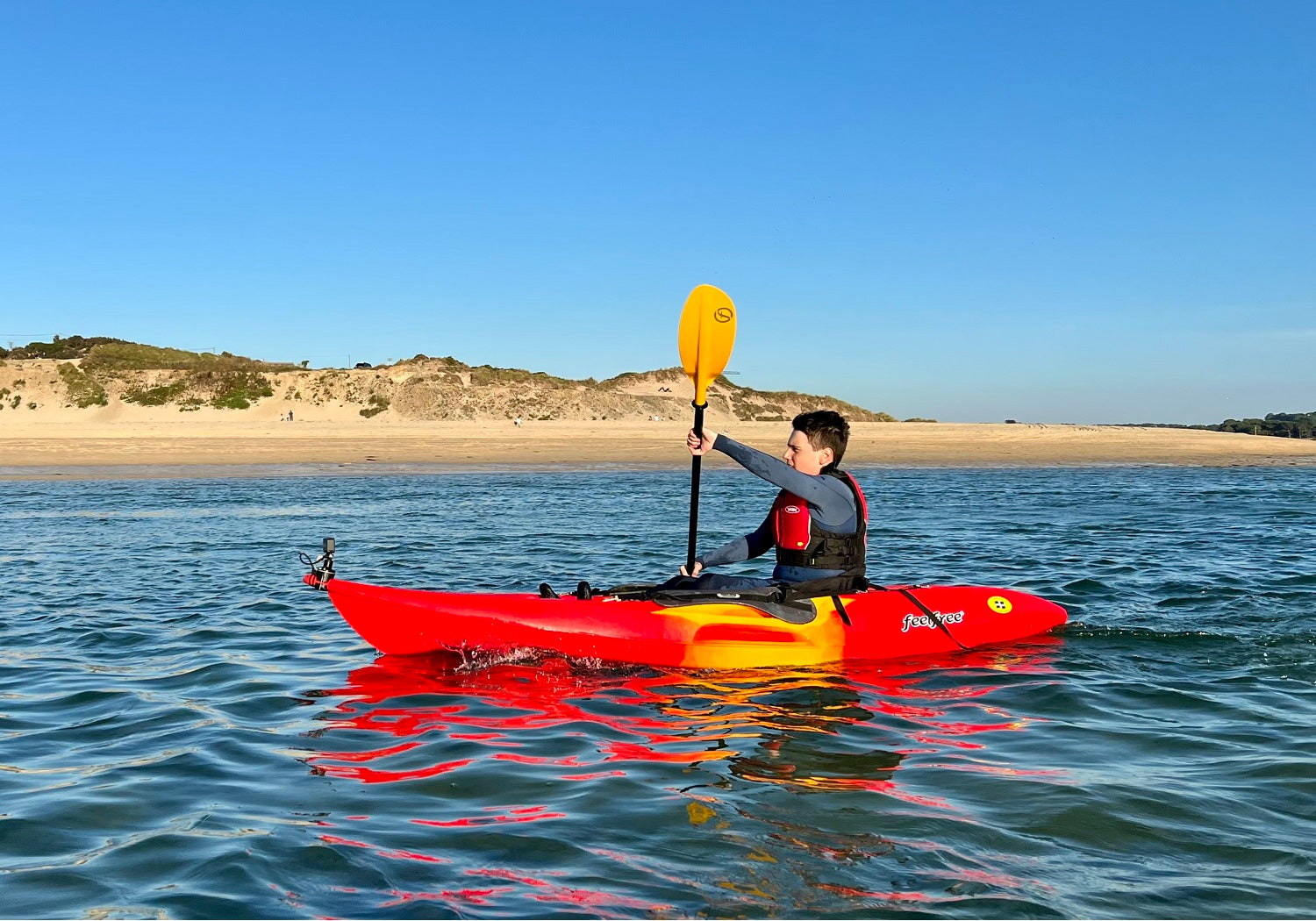 Kayaker wearing a buoyancy aid for safety