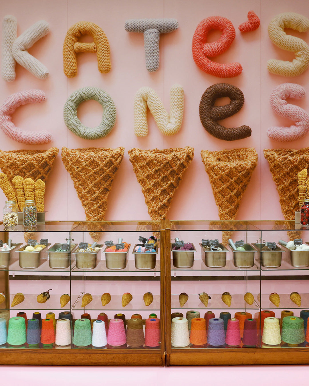 Women's creativity is celebrated through a playful yarn art installation featuring knit ice cream cones, brilliantly capturing the joyful fusion of art and imagination.
