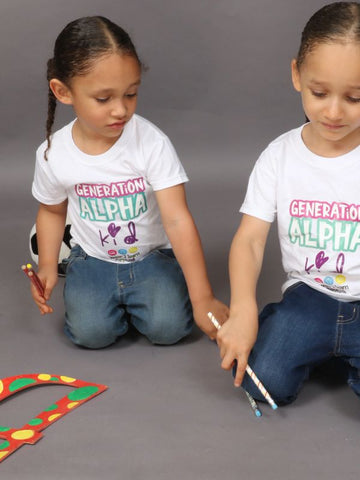Kids playing with Teach-shirts 4 Tots shirts on