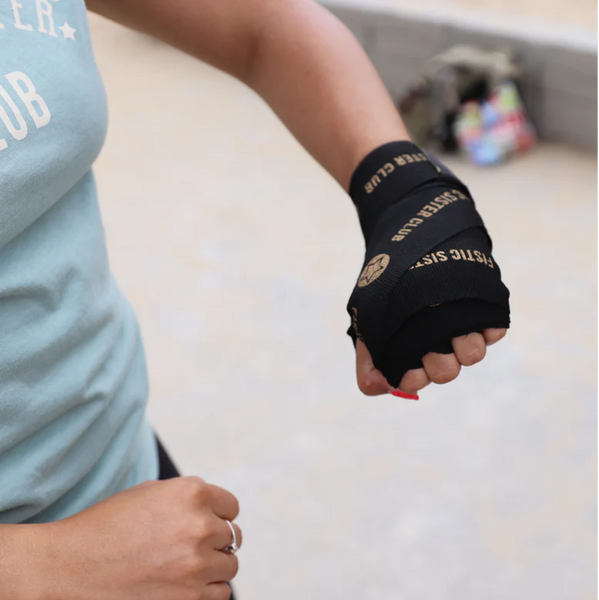boxer wearing Black Hand Wraps- Fistic Sister Club