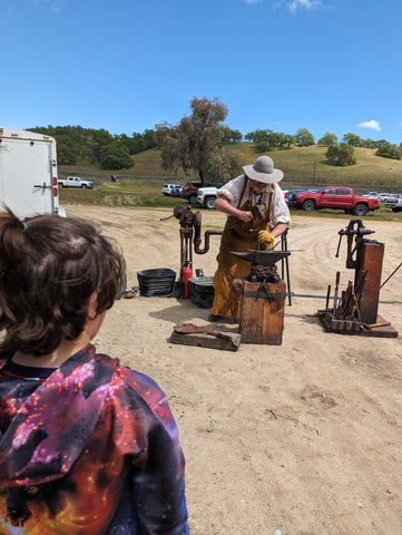 A blacksmith making biscuits during Mission Days at Mission San Antonio de Padua, in Fort Hunter Liggett, Monterey County, California’s central coast
